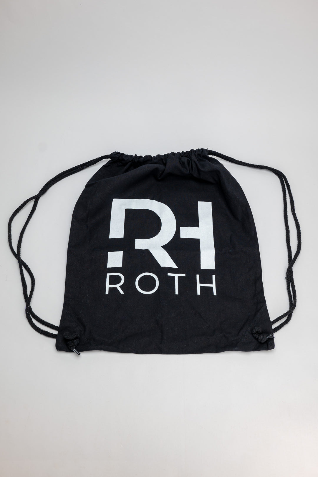 Schwarzer Jutebeutel mit weißem RH-TRi Logo bedruckt